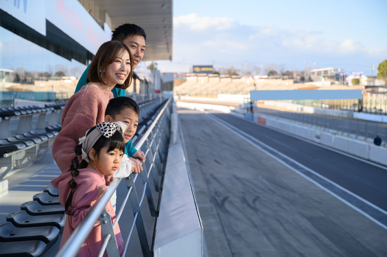 Outdoor terrace seats with a view of the pit