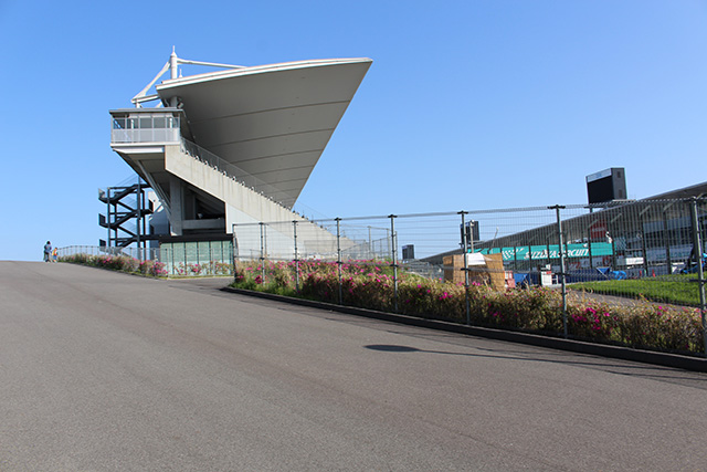 When you pass through the underground passage, you will come out next to the Grandstand.