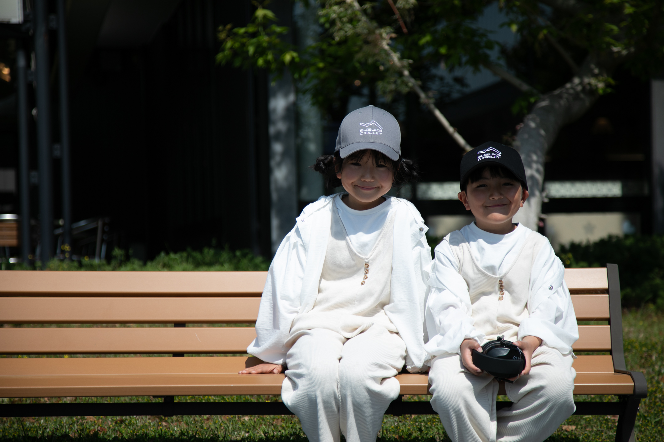 Children taking a break on benches inside the park