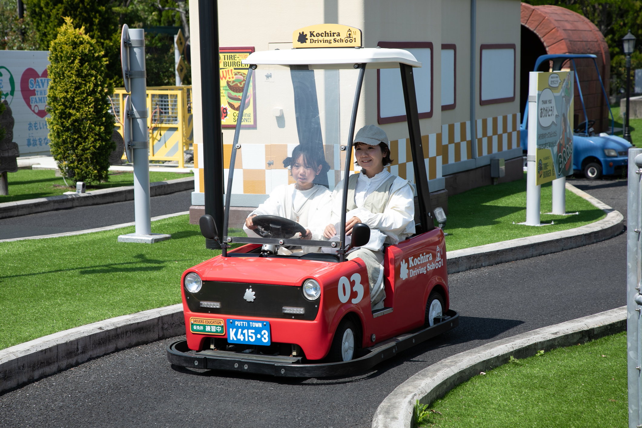 Children experiencing driving at Kochira's Driving School